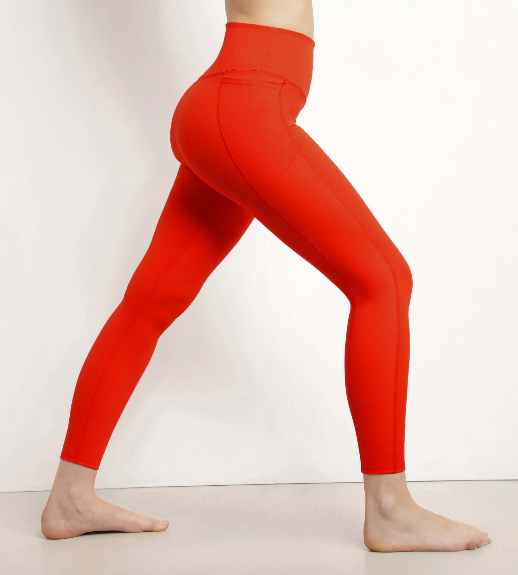 Women's sports leggings in orange sculpting microfibre Dim Move